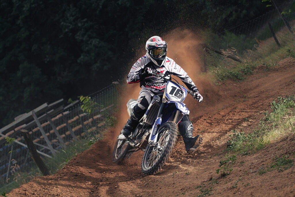Dirt-Slinging Adrenaline: Thrilling High-Action Motocross in Monochromatic Splendor Wallpaper