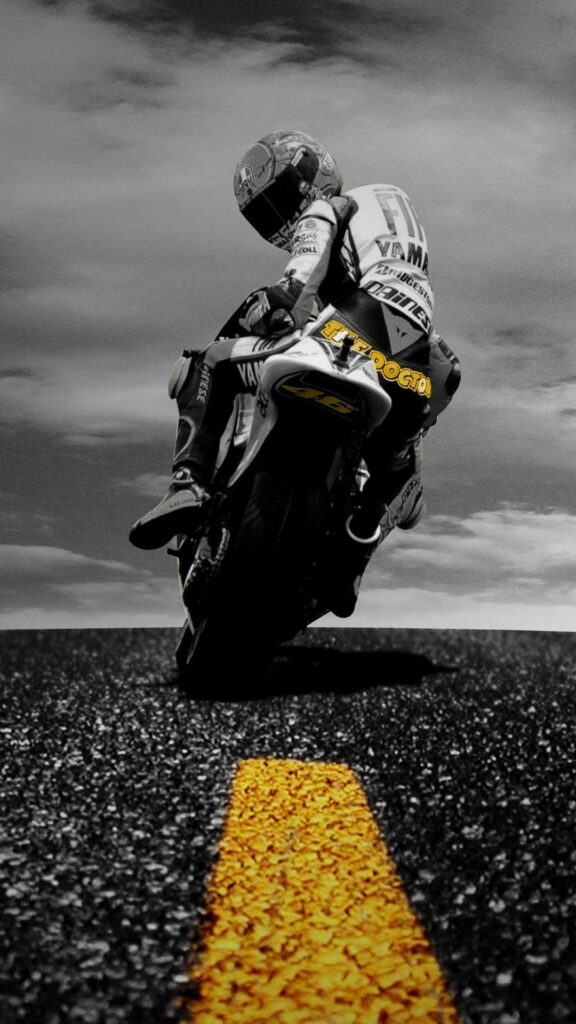 Motorcycle Bliss: A Spectacular Racer Zipping Through a Monochrome Wonderland Wallpaper
