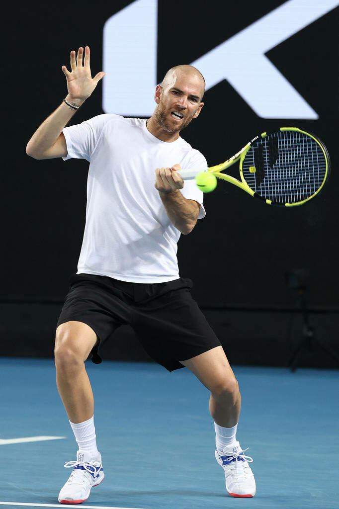 Adrian Mannarino intense forehand shot action tennis match dynamic court wallpaper background