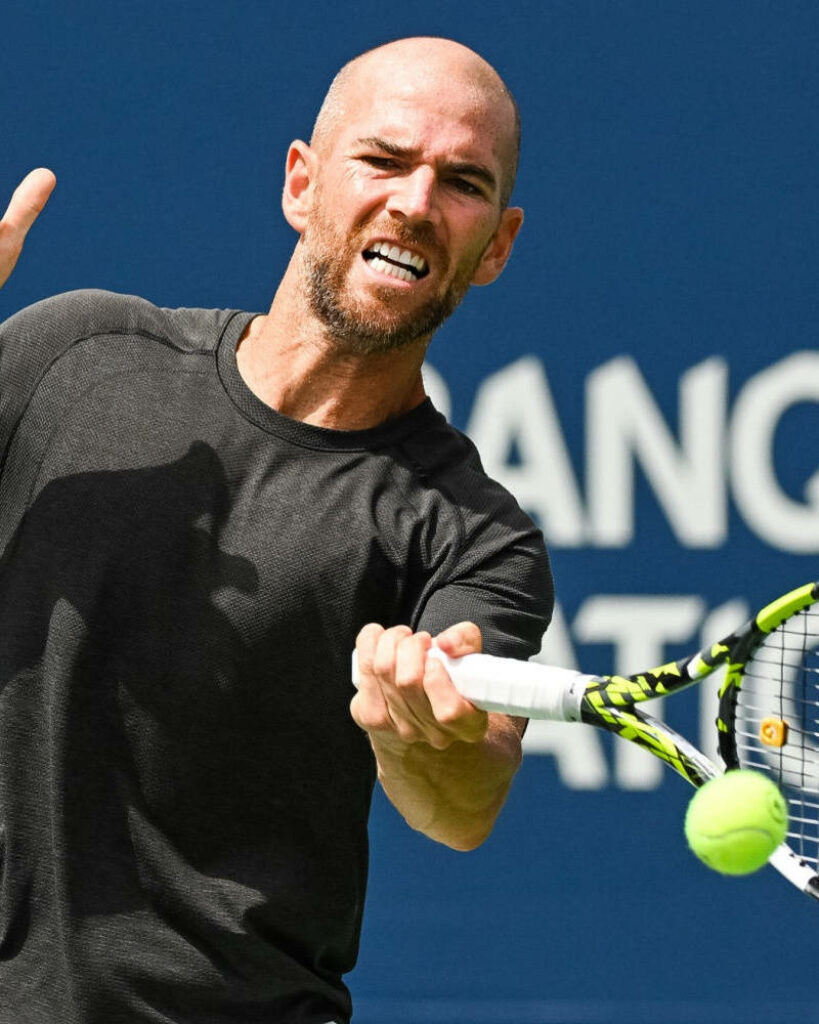 Adrian Mannarino tennis action focused return dynamic athletic wallpaper background