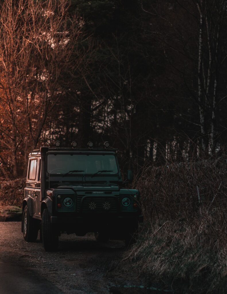 Rugged SUV Front View: Adventure in Nature's Embrace Wallpaper