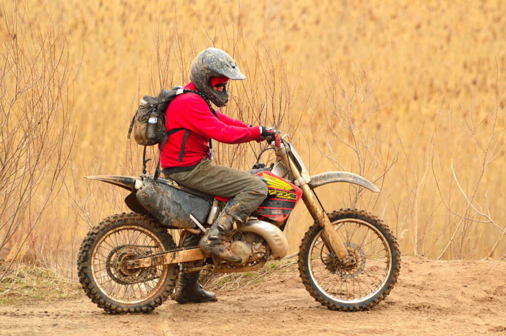 Adventure Wallpaper: Bike Rider on Rugged Dirt Road