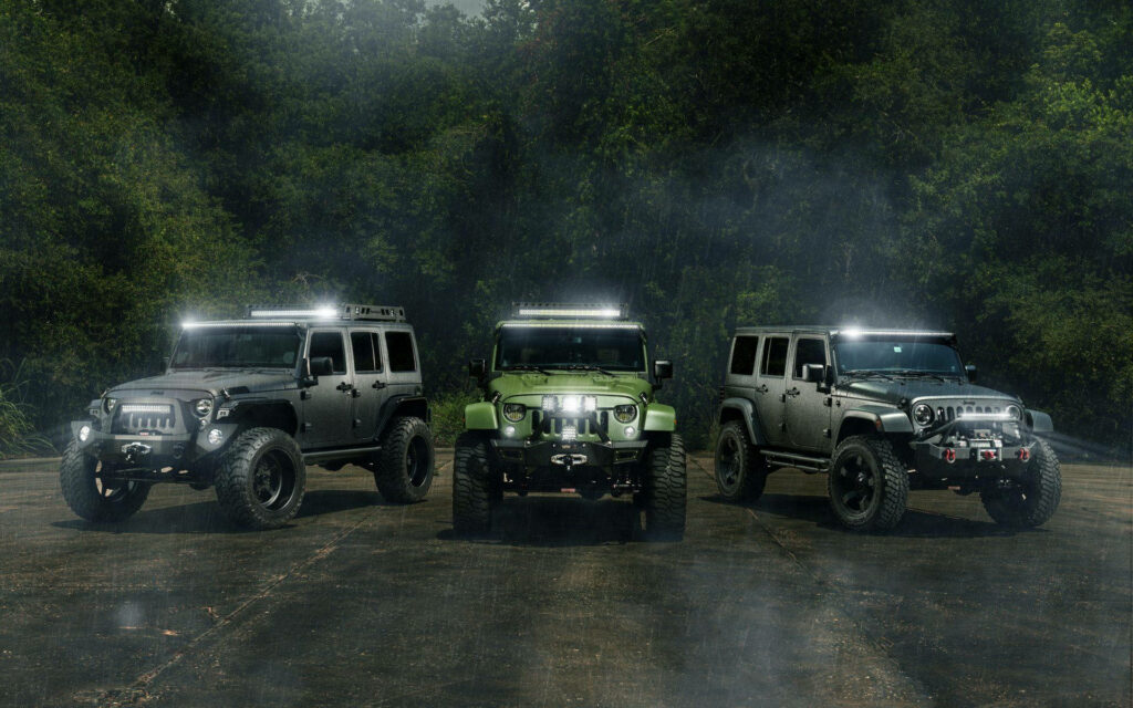 Adventure Awaits: Jeep Wranglers Wallpaper in Misty Forest