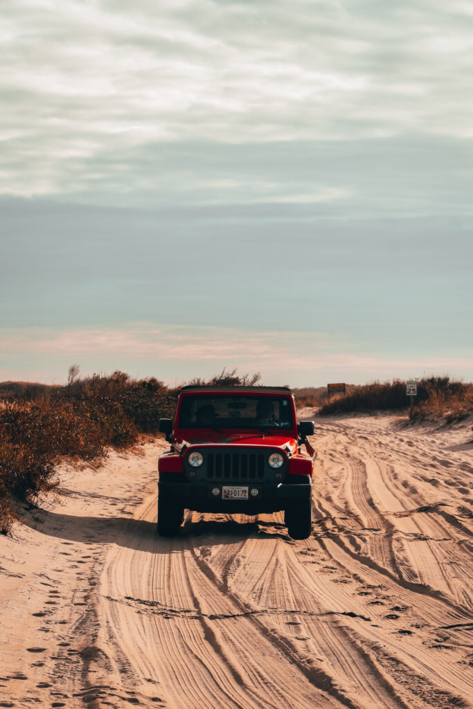 Adventurous Red Jeep Wrangler on Sandy Terrain - Off-Road Wallpaper