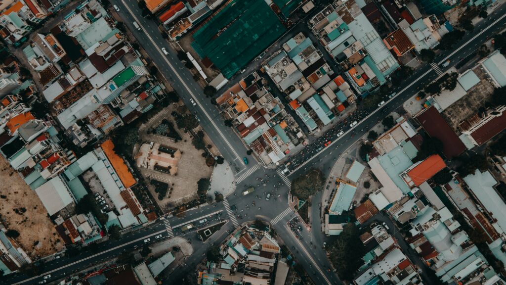 Vibrant Aerial City Intersection Wallpaper Background