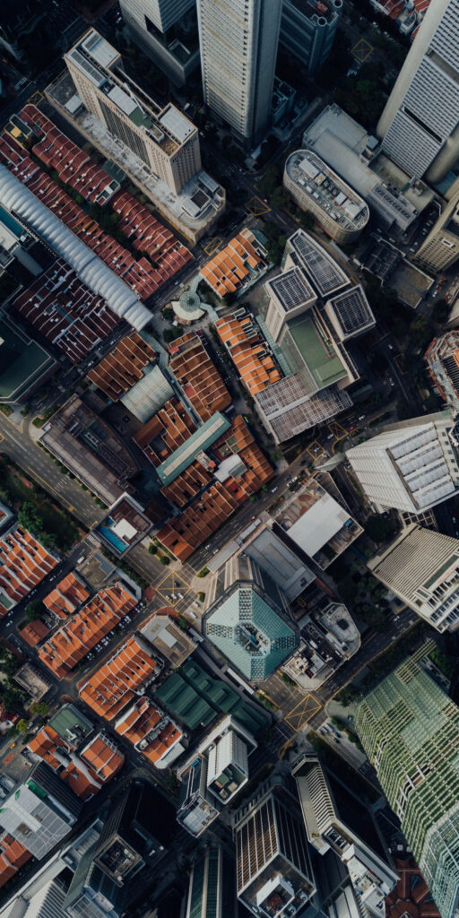 Vibrant Aerial City Wallpaper: Intricate Rooftops & Urban Landscape
