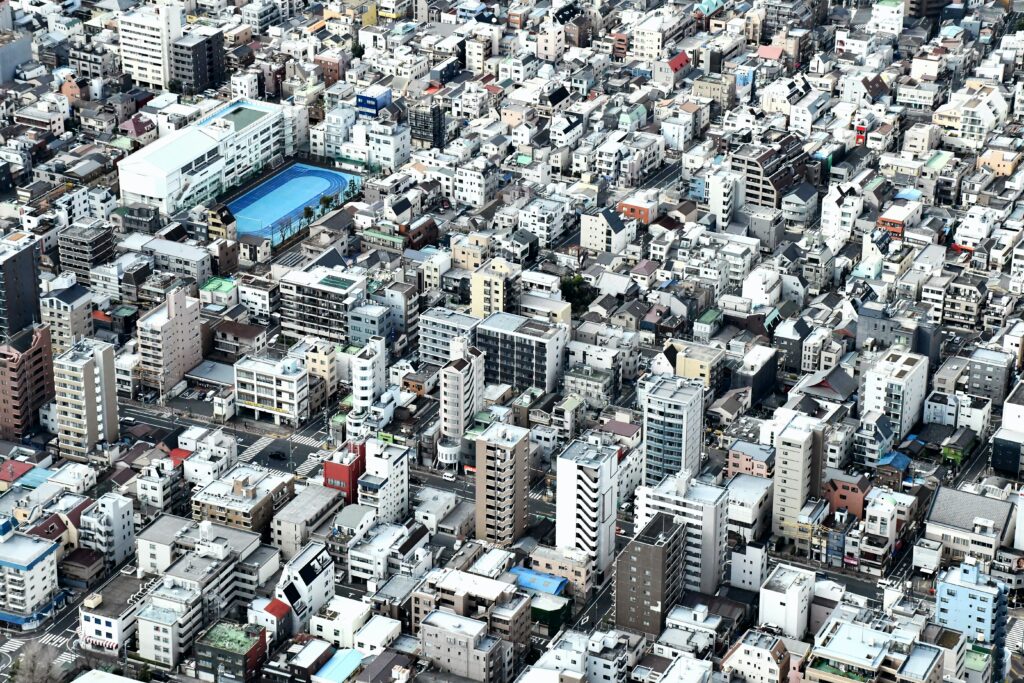 Stunning Aerial Cityscape Wallpaper: Densely-Packed Urban Landscape