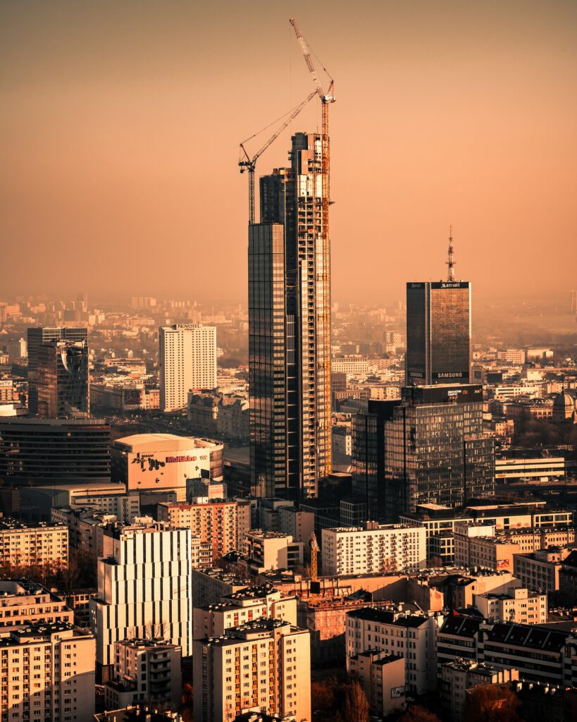 Aerial Cityscape Wallpaper: Towering Skyscrapers & Golden Glow