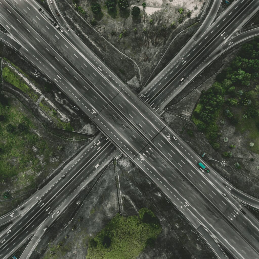 Aerial Road Interchange Wallpaper: Urban Landscape & Greenery Design