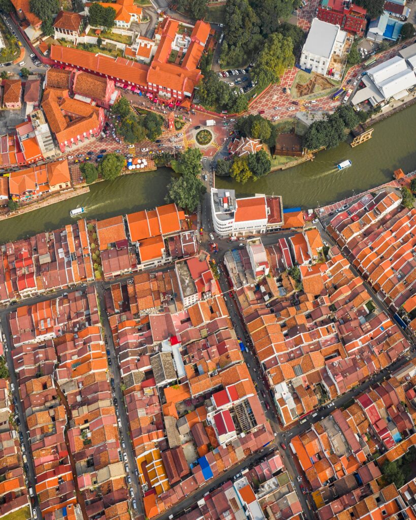 Vibrant Cityscape Wallpaper: Aerial View of Red-Roofed Buildings