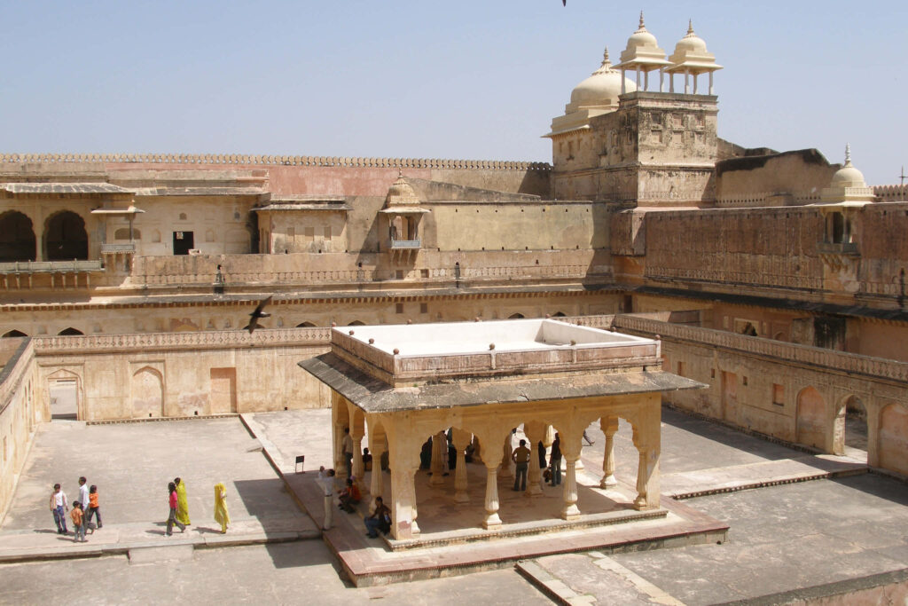 Aerial view of historic Amer Fort sandstone architecture and grand courtyards in daylight wallpaper
