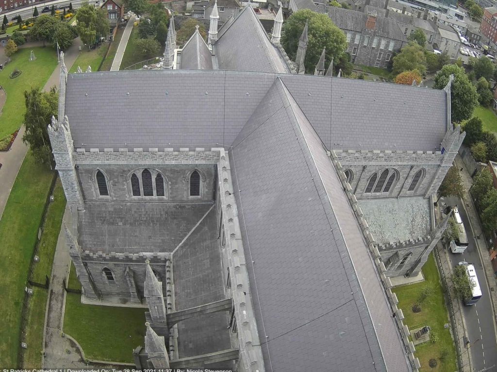 Aerial view of St. Patrick's Cathedral Dublin gothic architecture grey slate roof spires greenery Wallpaper