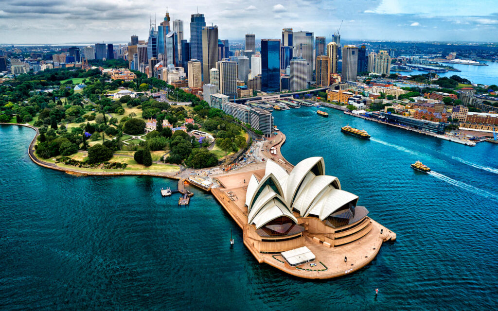 Stunning Aerial View of Sydney: Opera House, Skyline & Blue Waters Wallpaper