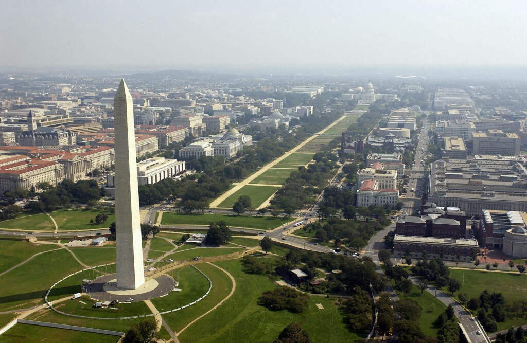 Stunning Aerial View of Washington Monument - Lush Greenery Wallpaper