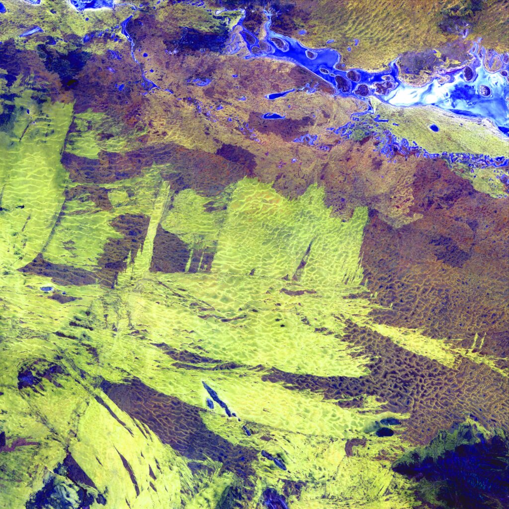 Vibrant Aerial Wallpaper: Earth's Surreal Patterns from Space View