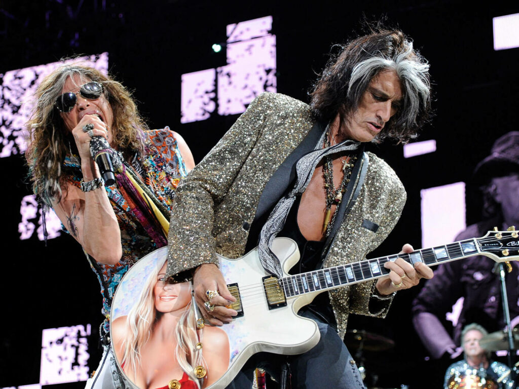 Dynamic Aerosmith Wallpaper: Tyler & Perry Rocking the Stage