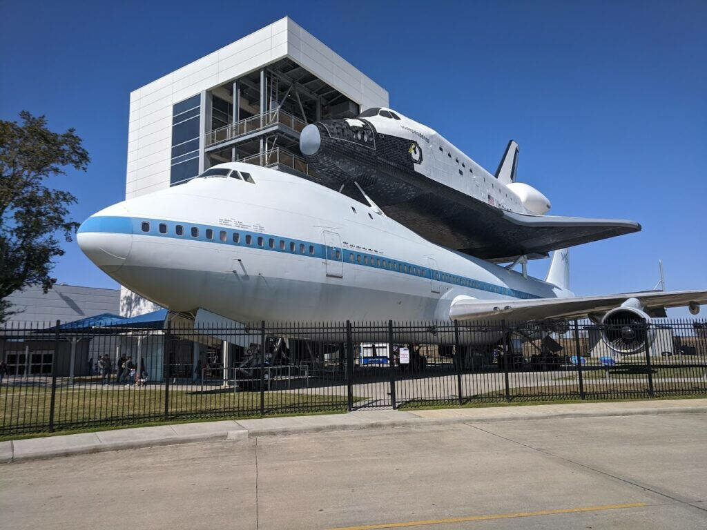 NASA Houston Wallpaper: Airplane Model with Space Shuttle Display