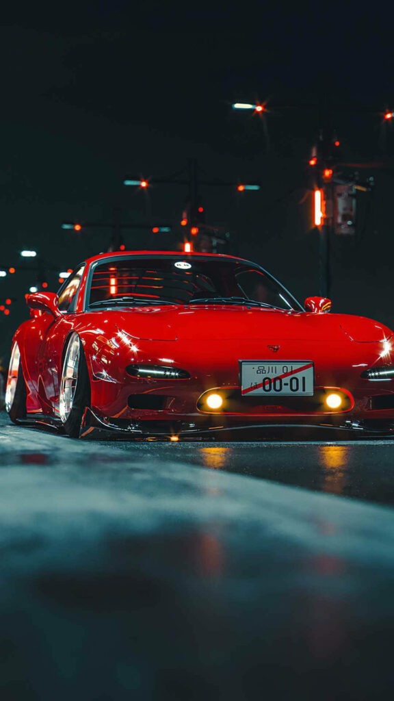Capturing the JDM Essence: A Mazda RX-7 Immersed in a Cool JDM Aesthetic Wallpaper