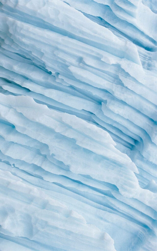 Blissful Serenity: Unveiling the Aesthetic Beauty of a Baby Blue Textured Surface Wallpaper