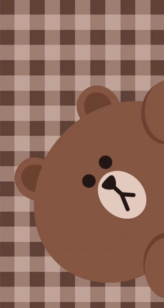 Aesthetically Pleasing Snapshot: Adorable Brown Bear Poses Against a Checkered Backdrop Wallpaper