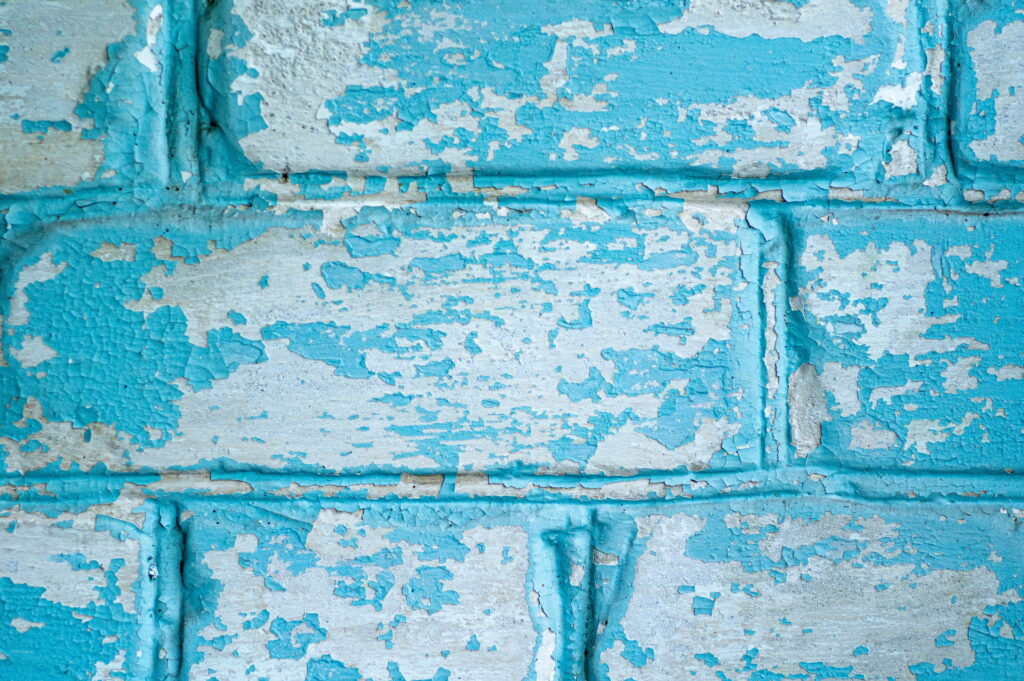 Colorful Patterns and Rough Textures: An Artistic 5K Wallpaper Featuring a Vibrant Painted Brick Wall