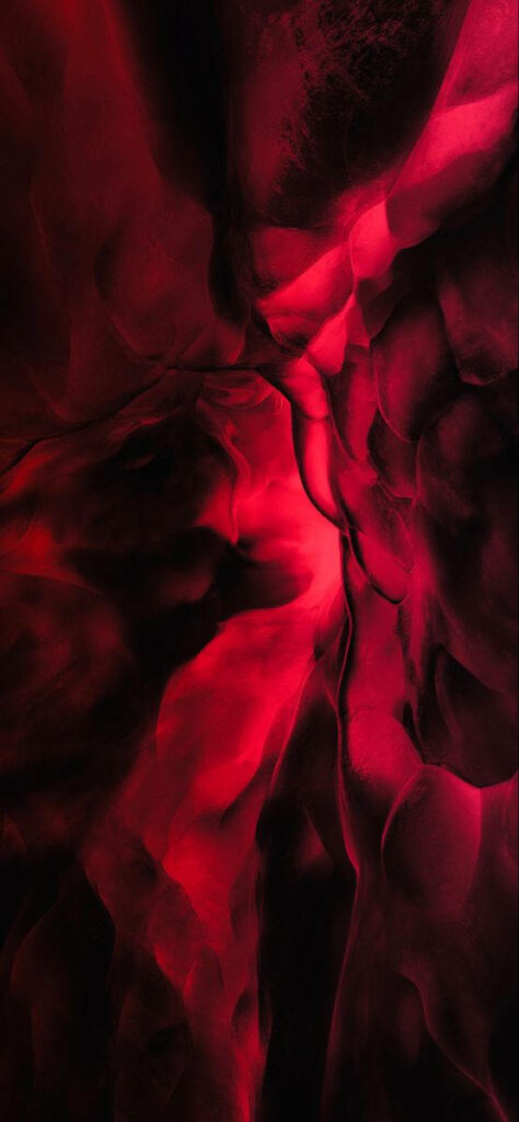 Abstract fiery red fluid swirls on deep black background sleek moody wallpaper for iPhone 12 Pro