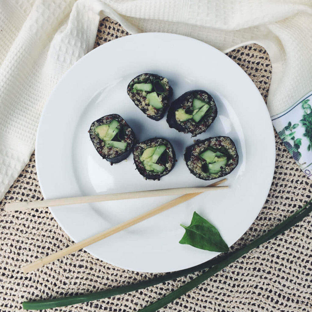 Aesthetic Sushi Rolls Wallpaper: Elegant Culinary Display Background