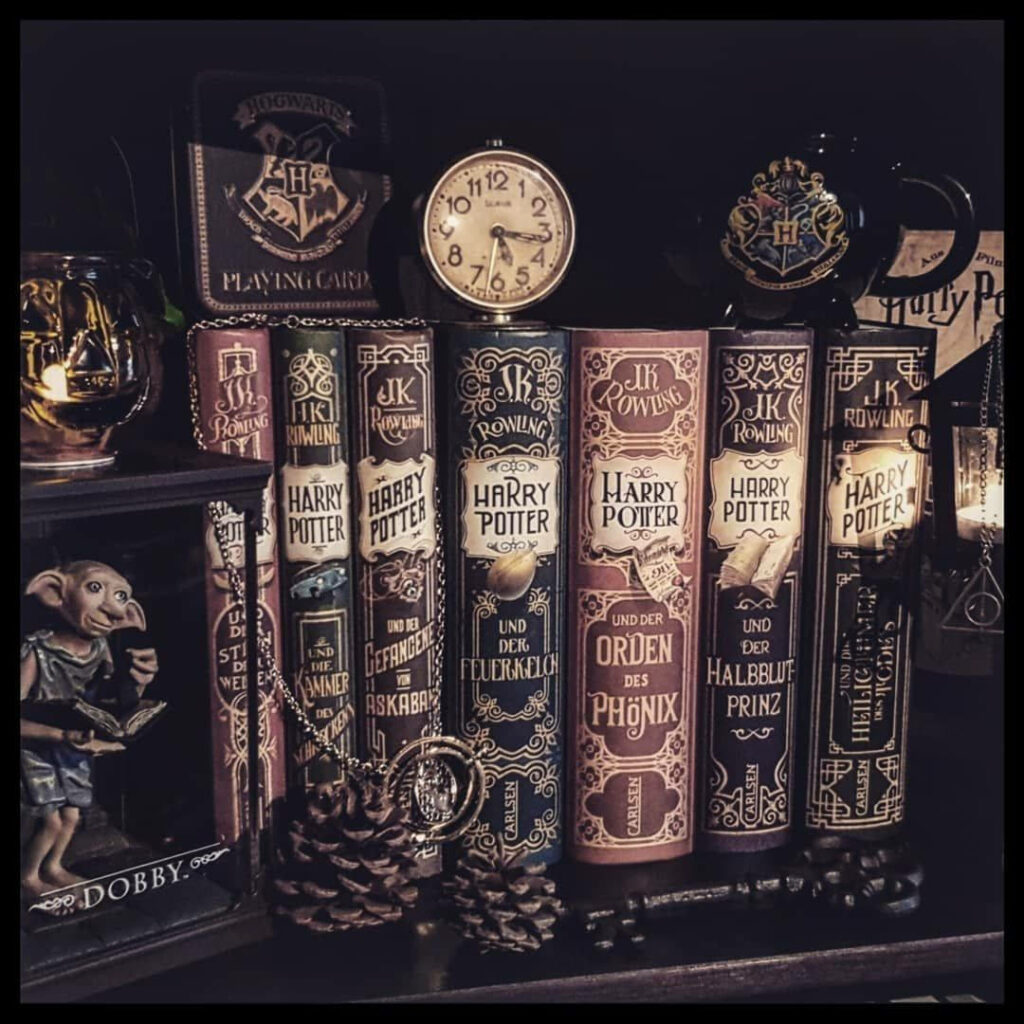 A Magical Composition: Captivating Harry Potter Literature Surrounded by Enchanting Memorabilia Wallpaper