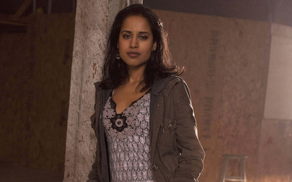 Agam Darshi portrait in rustic setting warm lighting stylish outfit confident expression wallpaper