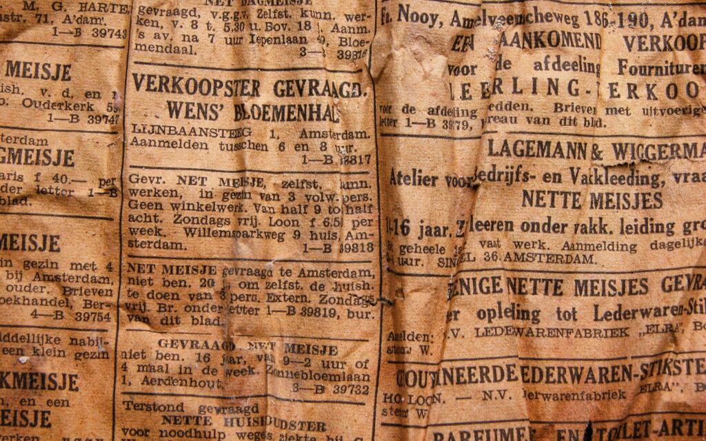A Vintage Snapshot: Quaint Old Newspaper Unveiling Macro Brown Paper Texture in Retro Background Wallpaper