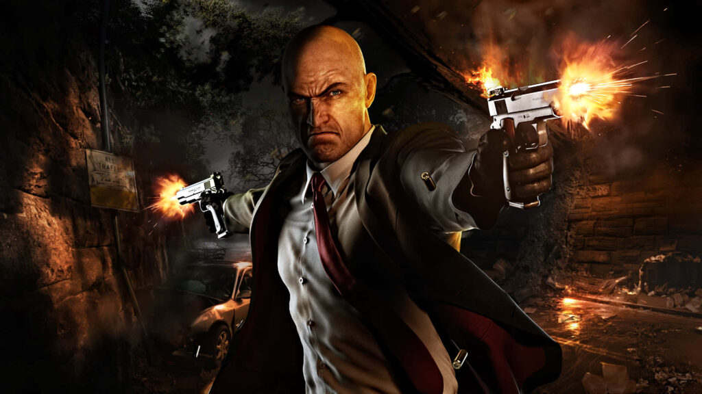 Deadly Precision: Hitman Agent 47 Takes Aim in the Darkened Warehouse Wallpaper