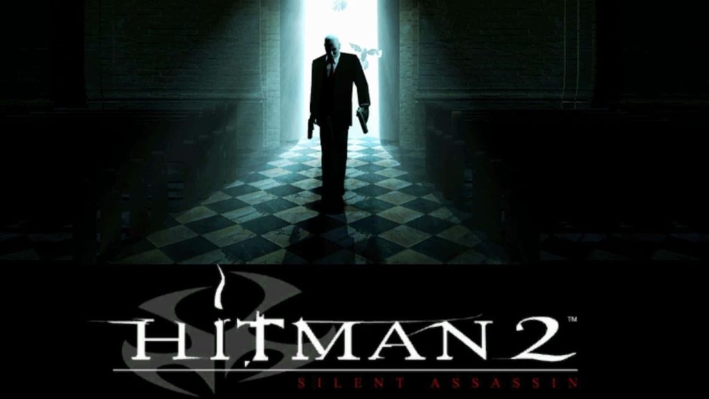 Agent 47 in Hitman 2 wallpaper walking dual-wielding pistols in shadowy backlit church scene