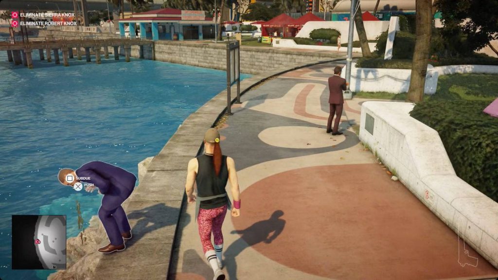 Agent 47 aims to subdue NPC in vibrant Miami The Finish Line mission Hitman 2 gameplay screenshot Wallpaper