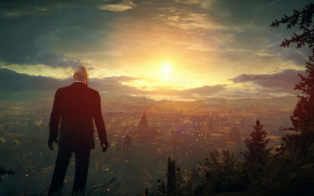 Dawn's Serene Gaze: Agent 47's Tranquil Vantage Point on a Illuminated Hamlet Wallpaper