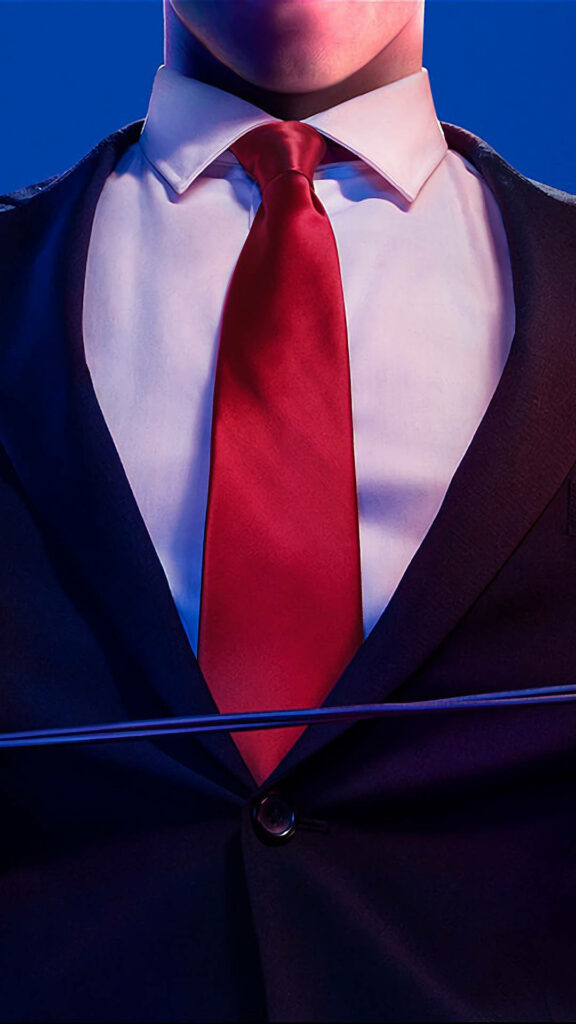 The Silent Assassin's Suited Attire: A Close-up Glimpse of Agent 47's Signature look in Hitman 2018 Wallpaper