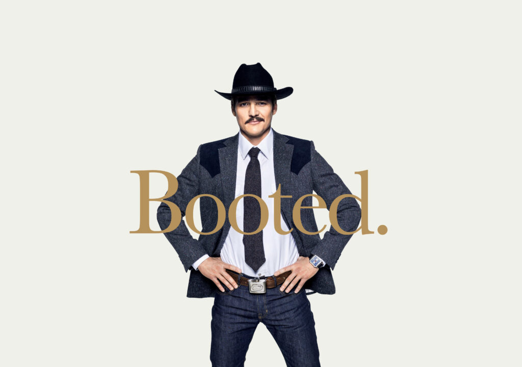 Agent Whiskey from Kingsman in cowboy hat and suit with Booted text minimalist wallpaper background