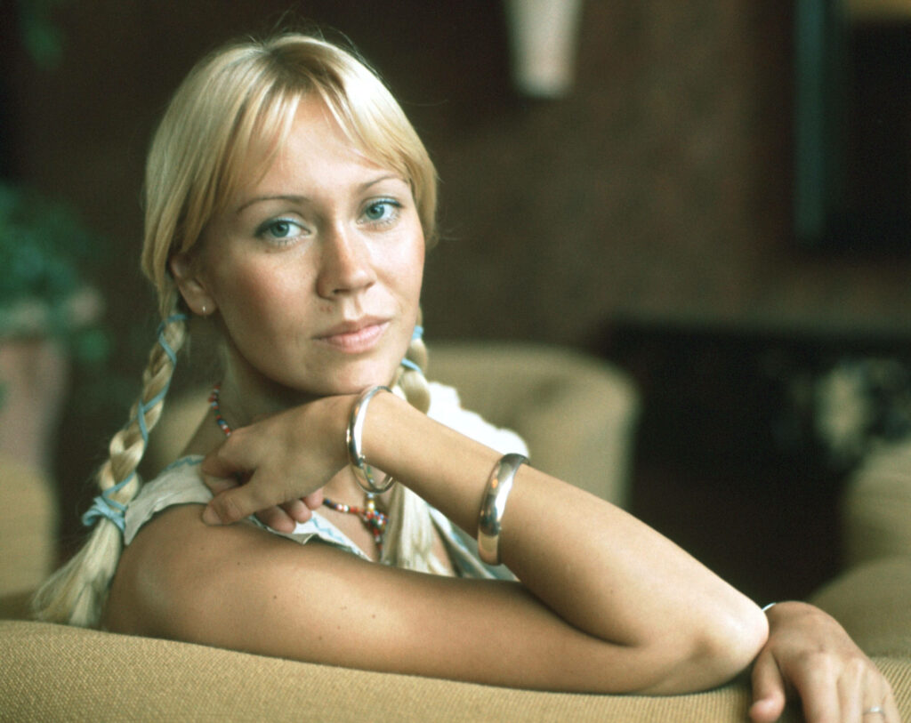 Young Agnetha Fältskog ABBA wallpaper classic music relaxed style iconic look background