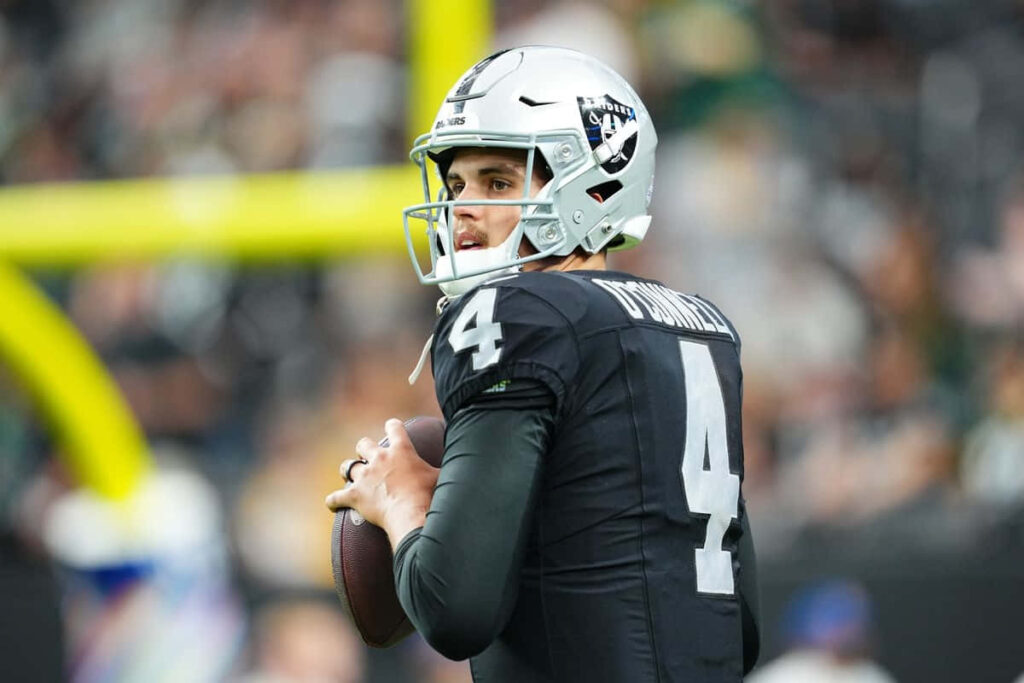Aidan OConnell focused quarterback preparing to throw football dynamic wallpaper background