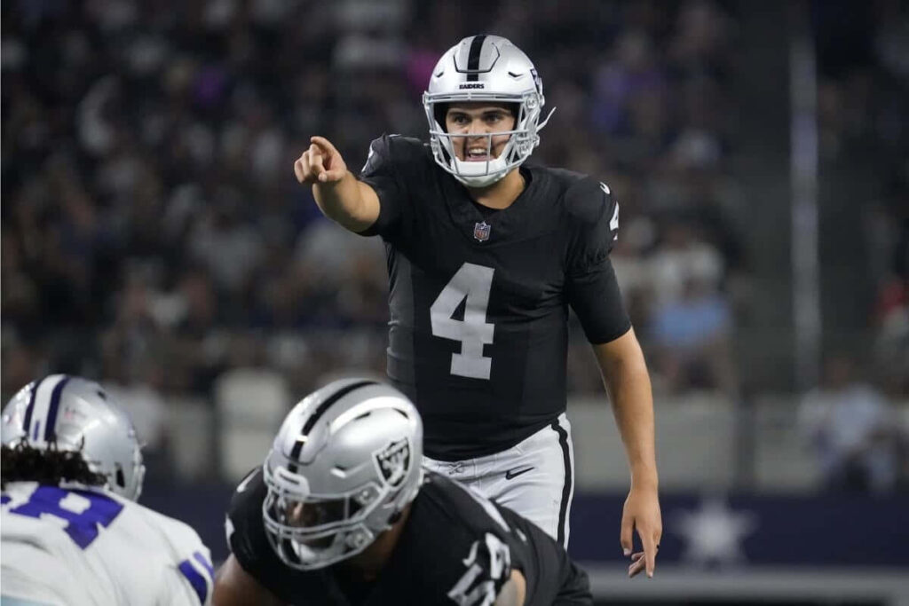 Aidan O'Connell Raiders quarterback confidently directing teammates on football field wallpaper