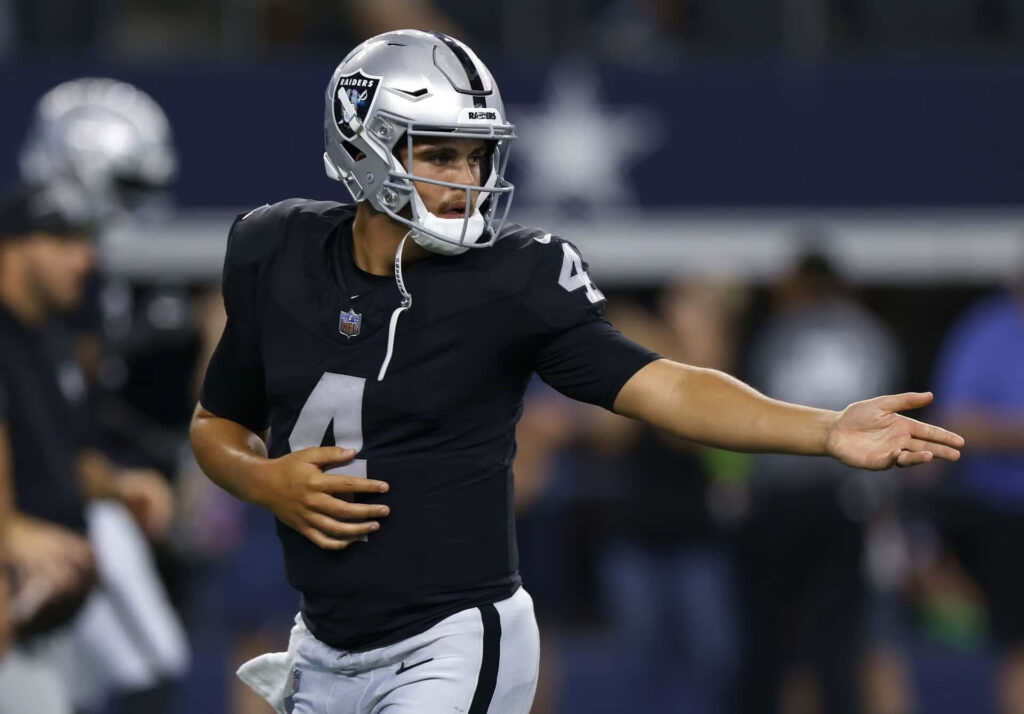 Aidan OConnell Raiders quarterback in action focused on football field mid-play wallpaper background