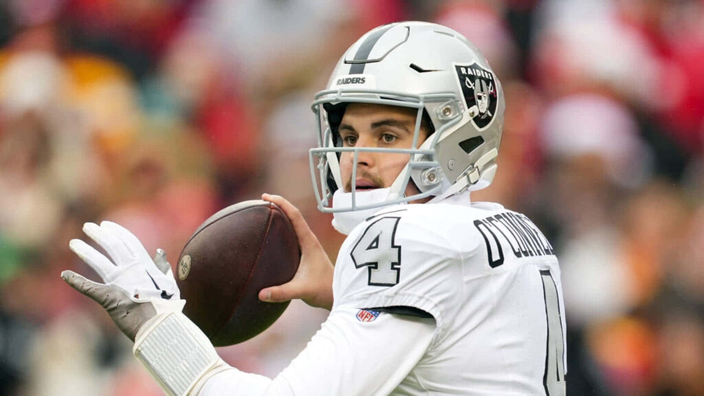 Aidan OConnell in full Raiders uniform poised for quarterback play against wallpaper background