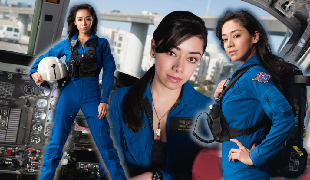 Aimee Garcia smiling confidently with vibrant blue background positive wallpaper image