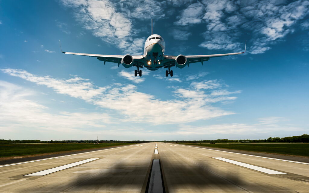 Skyward Soaring: Captivating HD Photo of Passenger Liner Takeoff at Runway Wallpaper