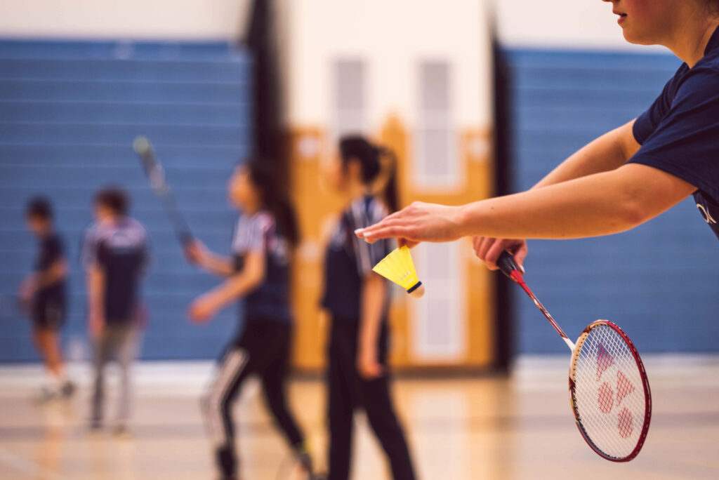 Powerful Precision: Athletic Brilliance in Badminton Wallpaper