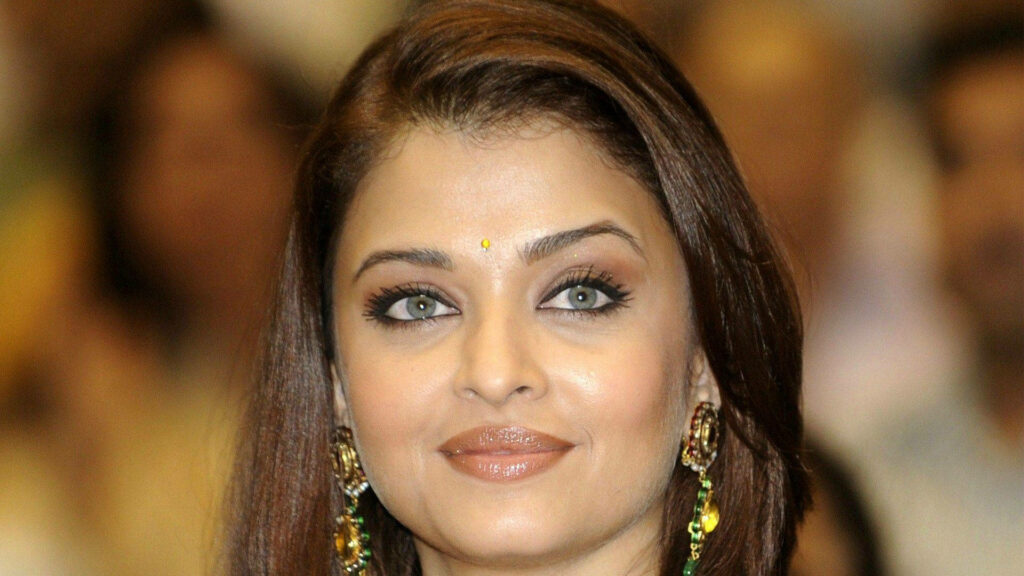 Aishwarya Rai Bachchan portrait with traditional bindi showcasing green eyes and radiant expression Wallpaper