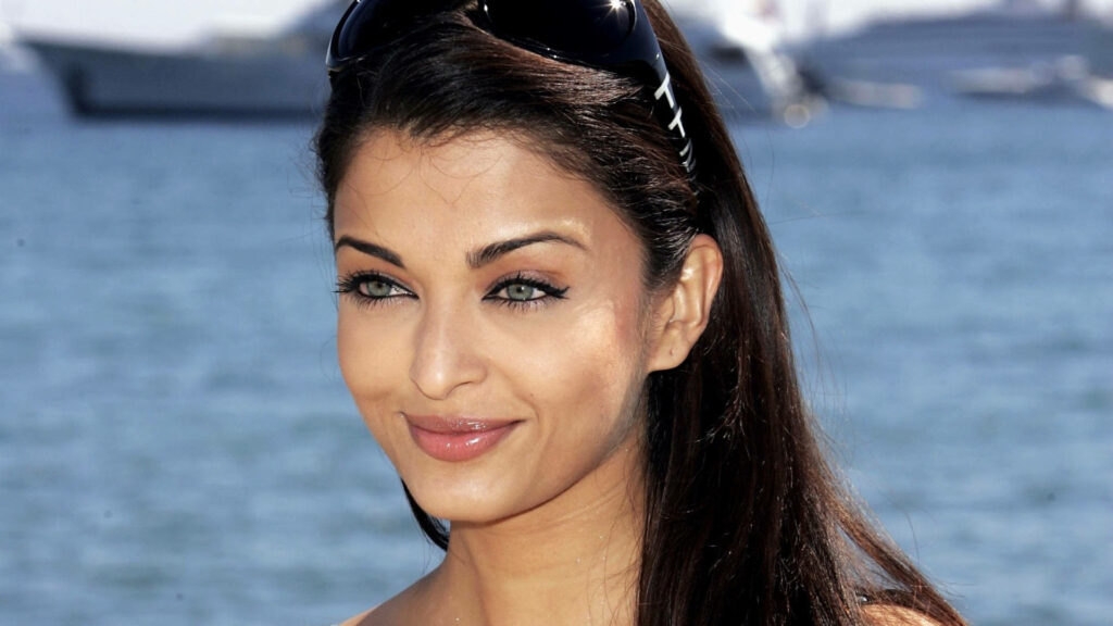 Aishwarya Rai natural makeup serene beach background timeless beauty wallpaper image
