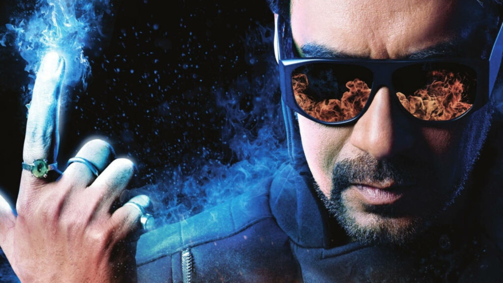 Ajay Devgn intense Action Jackson movie poster with vibrant blue and fiery reflections wallpaper