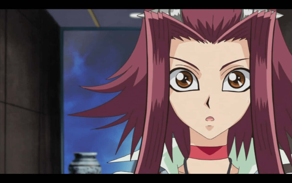 Akiza Izinski from Yu-Gi-Oh 5Ds close up with red hair and expressive eyes dramatic wallpaper background