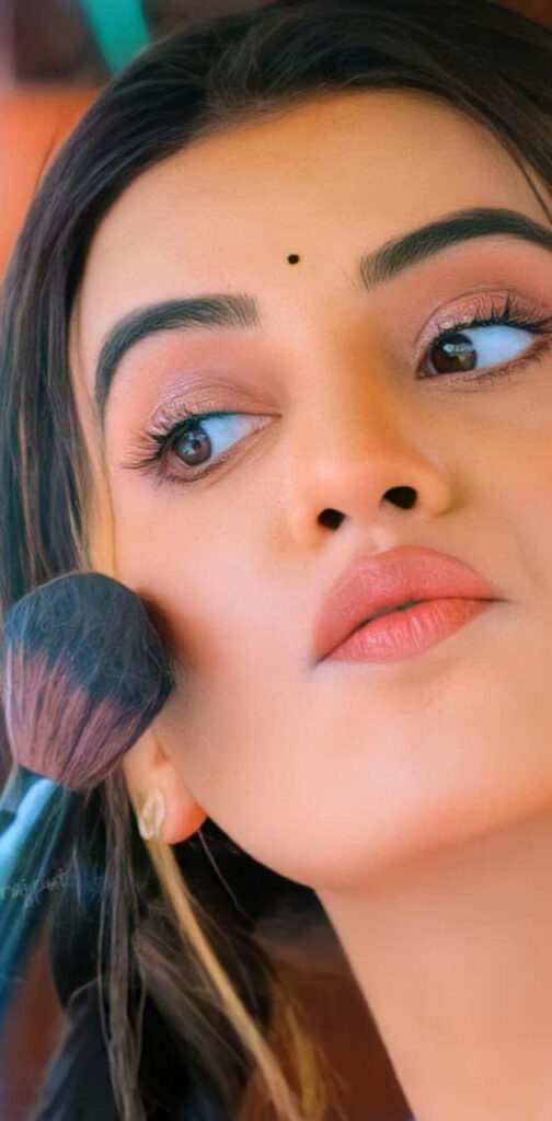 Close-up of Akshara Singh with soft makeup natural lighting highlighting expressive eyes wallpaper