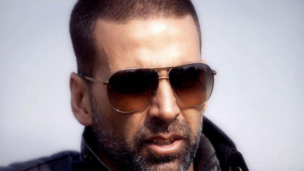 Akshay Kumar close up wearing stylish sunglasses rugged look bold charismatic wallpaper background